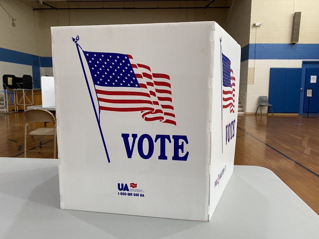 White polling box with American flag