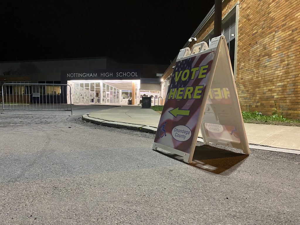 A "Vote Here" sign sits just in front of Nottingham High School.