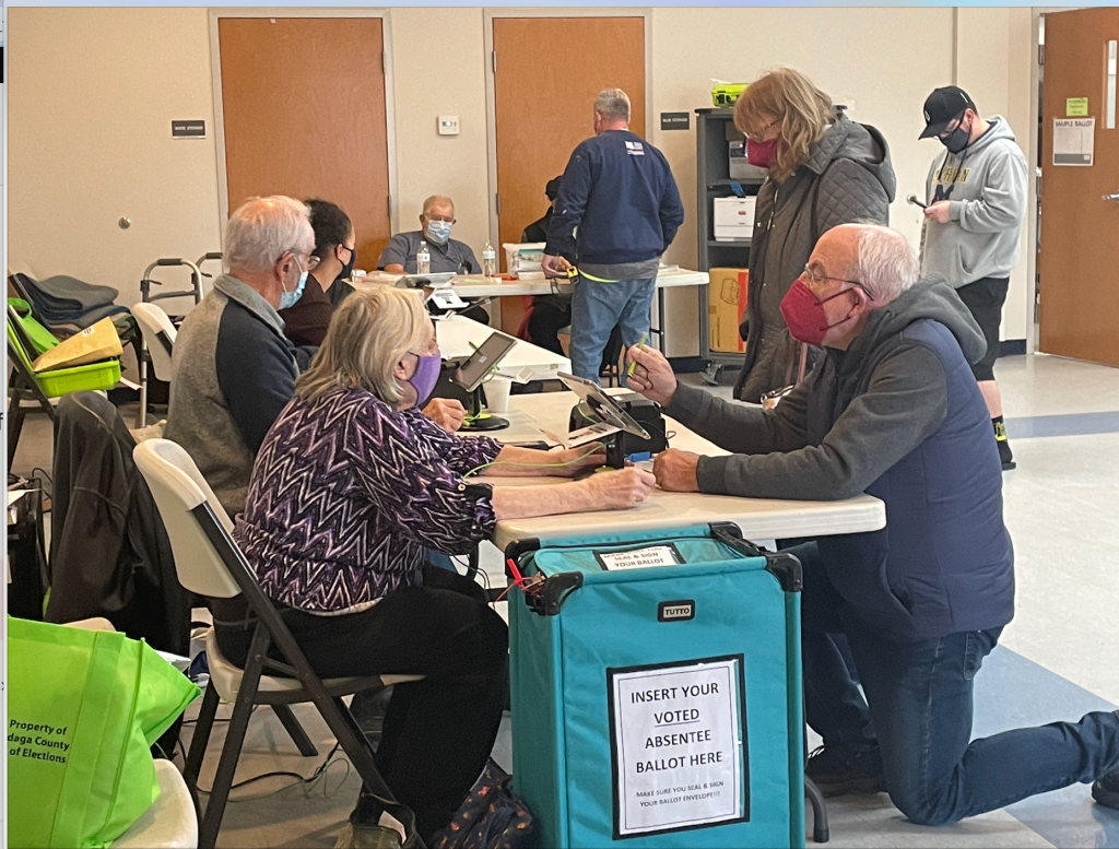 Poll workers help voters in East Syracuse