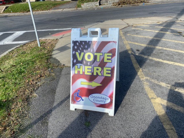 A sign promoting the polling place